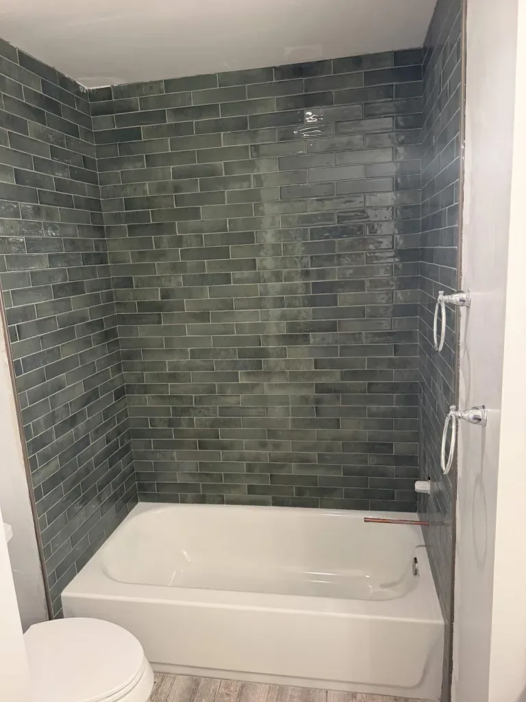 Green subway tile tub surround
