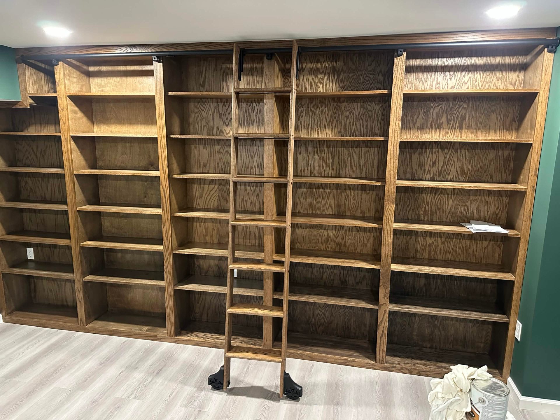Floor-to-ceiling oak library with rolling ladder