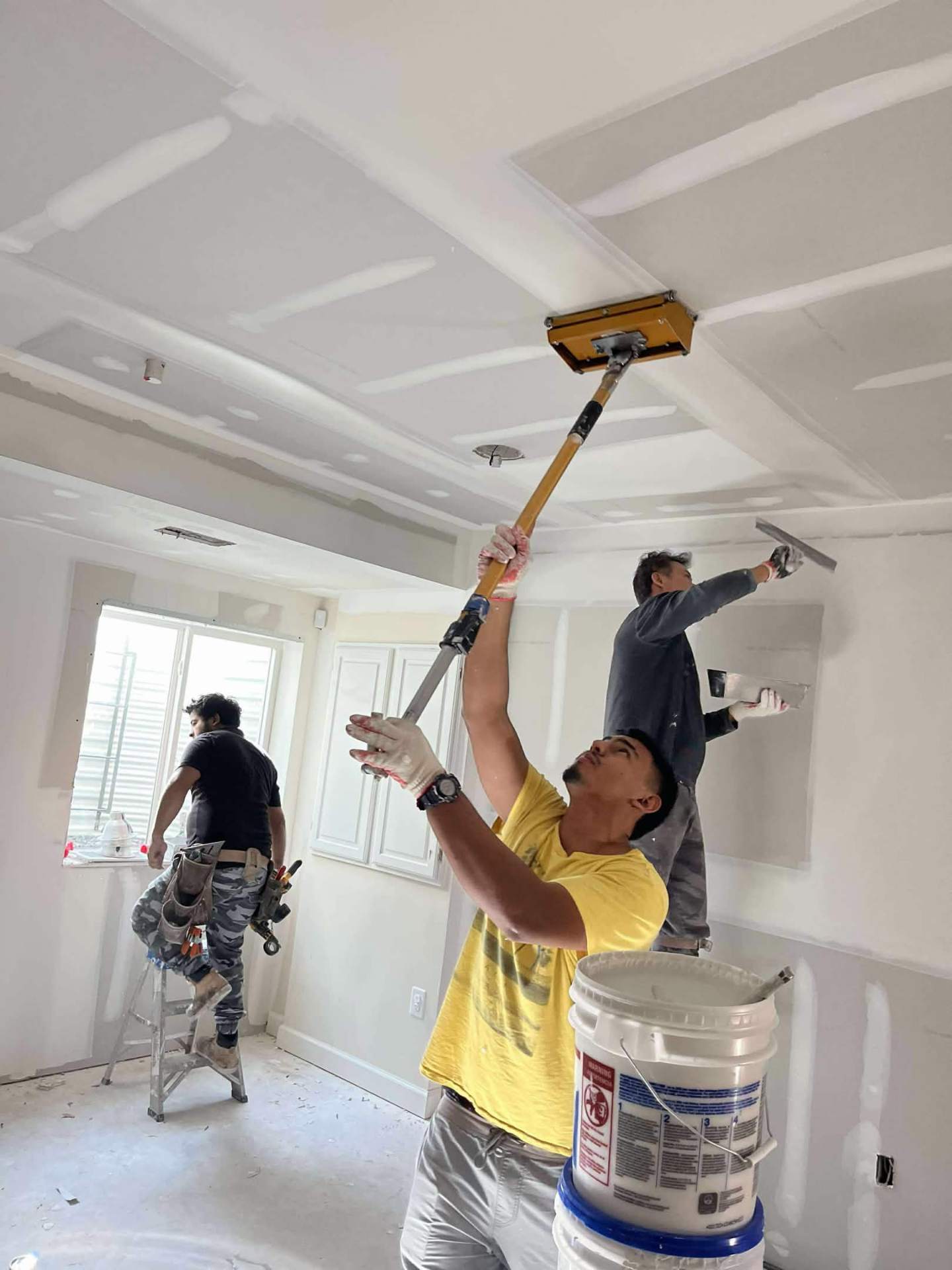Skim-coating ceilings to a mirror finish